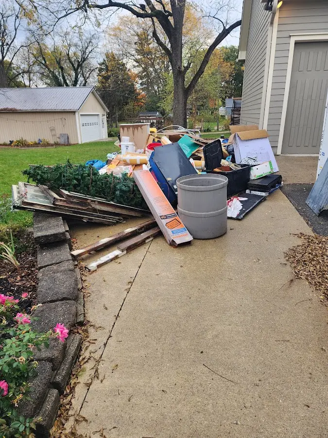 Dumpster being loaded with debris for 10 Yard Dumpster Rental in Belleair